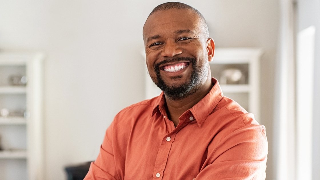 Smiling Man in Salmon Colored Shirt