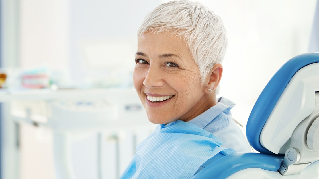 Smiling Patient At Dentist Photo